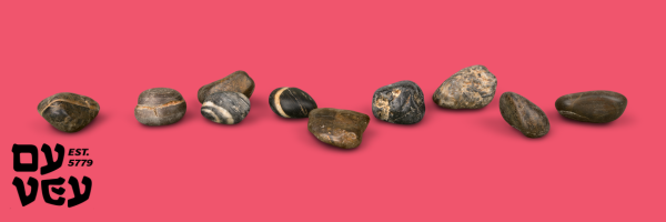 Stones that represent mourning on a rose-colored background
