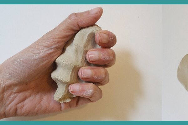 Person holding clay in palm during make your own chanoekia workshop with Oy Vey